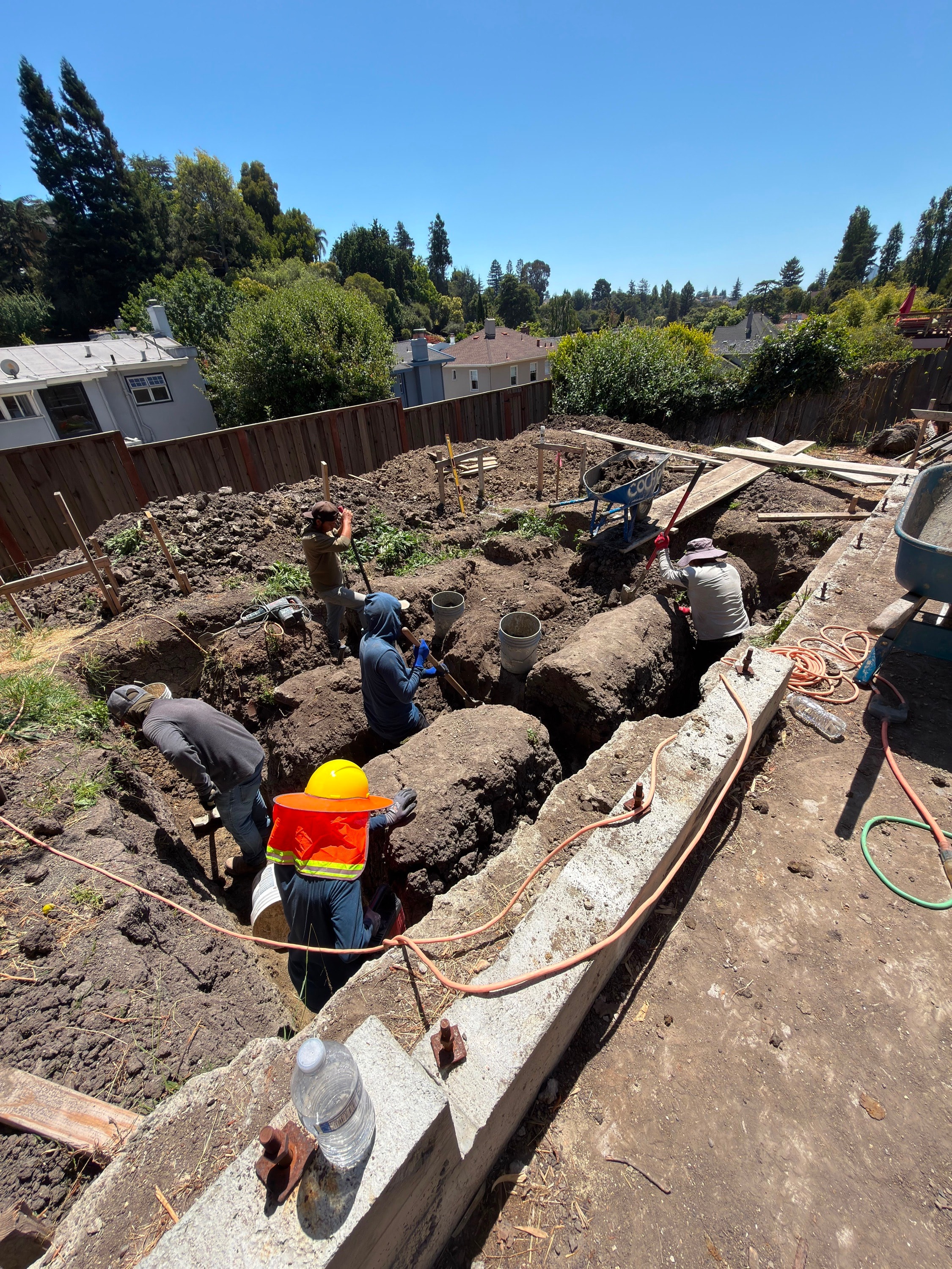 WG crew hand-digging footing trenches on a Bay Area lot